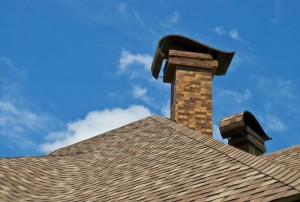Masonry Brick Chimney on Brown Roof - Memphis TN - Coopertown Services